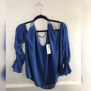 Flirty Jessica Simpson cold shoulder shirt.